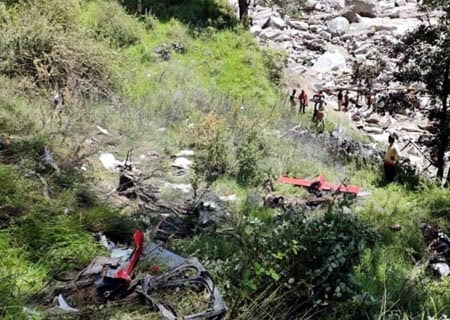 <p>Uttarkashi: Locals and officials gather at the site where a helicopter involved in relief efforts in flood-hit Uttarakhand crashed in the Uttarkashi district, on Aug 21, 2019. Three…