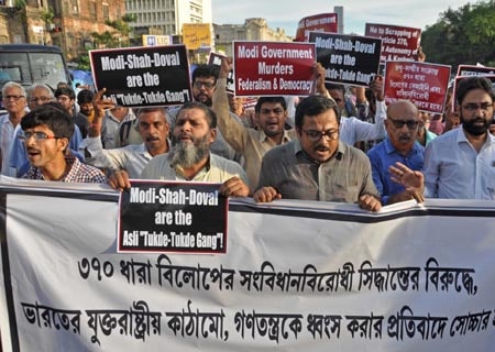 <p>Kolkata: A group of people protests against the Centre's decision to scrap Article 370 of the Constitution that gives special powers to Jammu and Kashmir; in Kolkata on Aug…