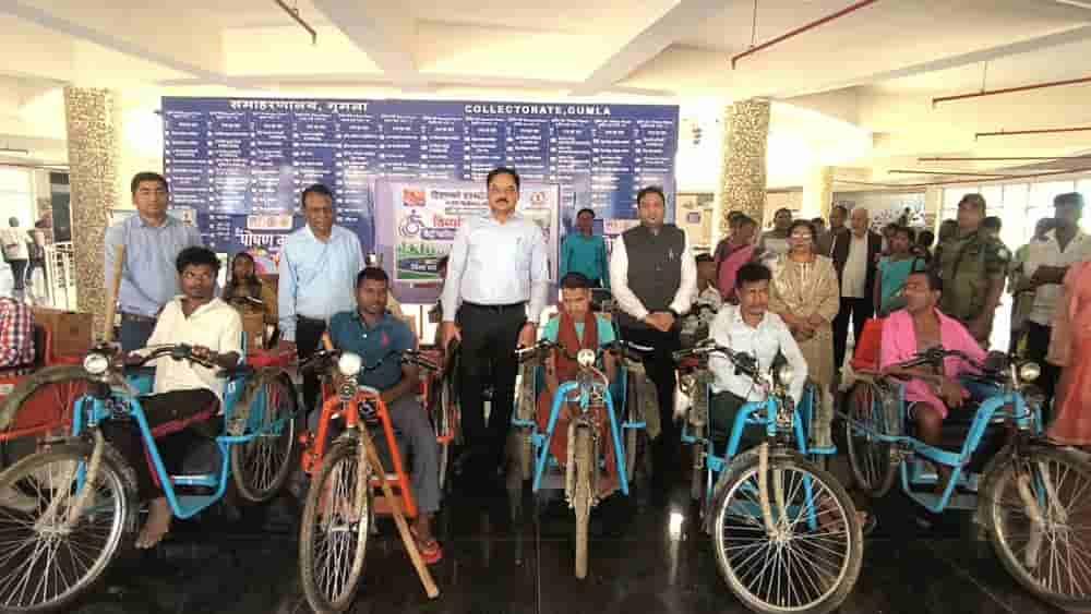 hindalco-gumla-administration-distribute-motorised-tricycles-to-20-persons-with-disabilities
