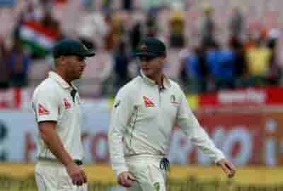 Spectators wave sandpapers at Warner, Bancroft at Ashes