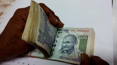 Rupee hits new record low of 76.82/$
